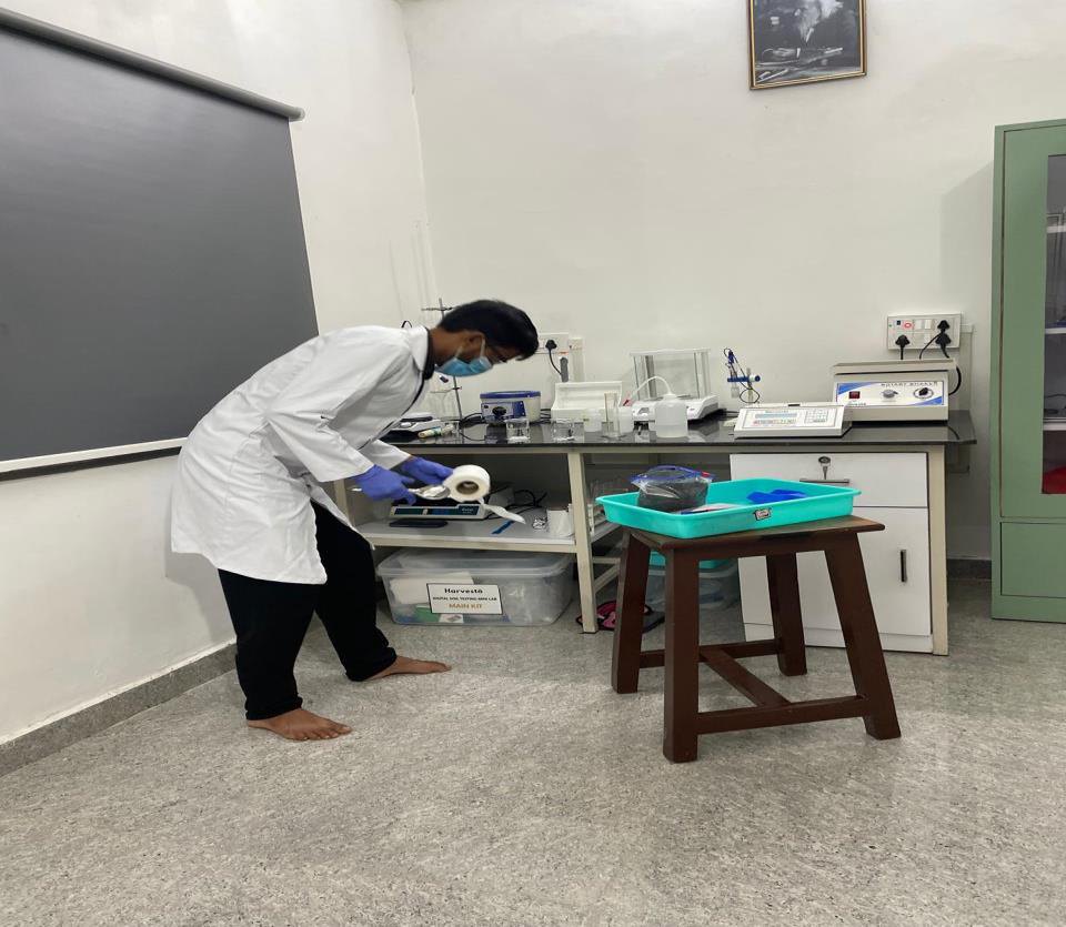 NRL researcher working at the laboratory bench